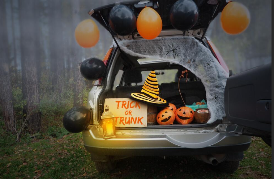 trunk or treat, depicts Halloween themed trunk decoration